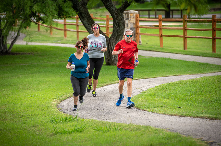 Group od seniors running through the trails at Blue Skies of Texas.